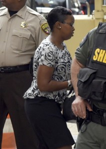 Alicia D. White, one of six Baltimore city police officers charged in connection with Freddie Gray's death arrives at a side door, for a court appearance on Tuesday, Oct. 13, 2015 in Baltimore. All six officers appeared before Judge Barry Williams, who is to determine whether their still undisclosed statements will be allowed at trial. (Barbara Haddock Taylor /The Baltimore Sun via AP) WASHINGTON EXAMINER OUT; MANDATORY CREDIT