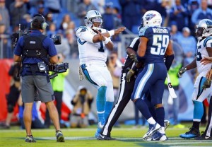 Carolina Panthers quarterback Cam Newton (1) does his touchdown celebration in front of Tennessee Titans inside linebacker Avery Williamson (54) during an NFL football game Sunday, Nov. 15, 2015, in Nashville, Tenn. The Panthers won 27-10. (Jeff Haynes/AP Images for Panini)