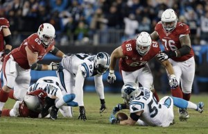 Carolina Panthers' Luke Kuechly recovers a fumble by Arizona Cardinals' Carson Palmer during the first half the NFL football NFC Championship game Sunday, Jan. 24, 2016, in Charlotte, N.C. (AP Photo/Bob Leverone)