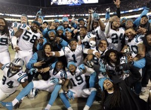 Some Carolina Panthers celebrate from the bench during the second half the NFL football NFC Championship game against the Arizona Cardinals, Sunday, Jan. 24, 2016, in Charlotte, N.C. (AP Photo/Chuck Burton)